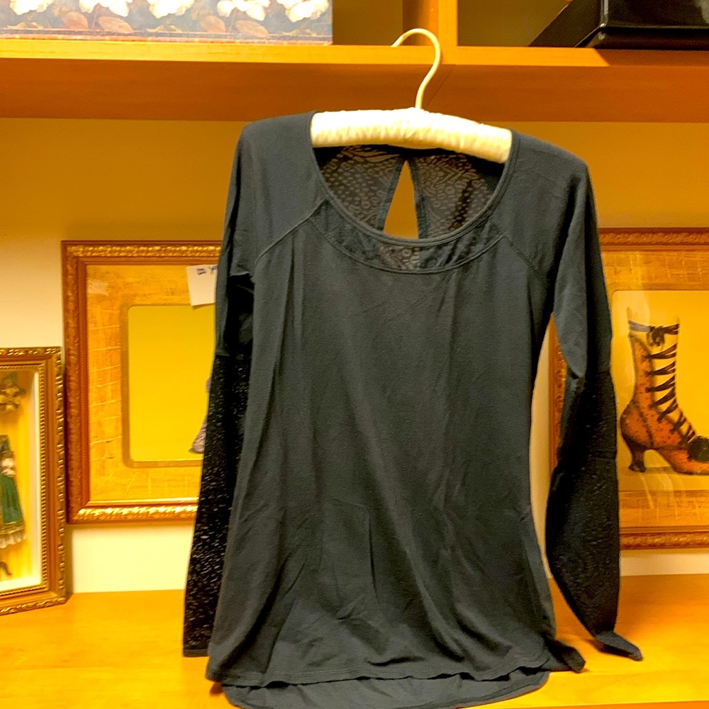 Workout top with lace like detail . Size S.